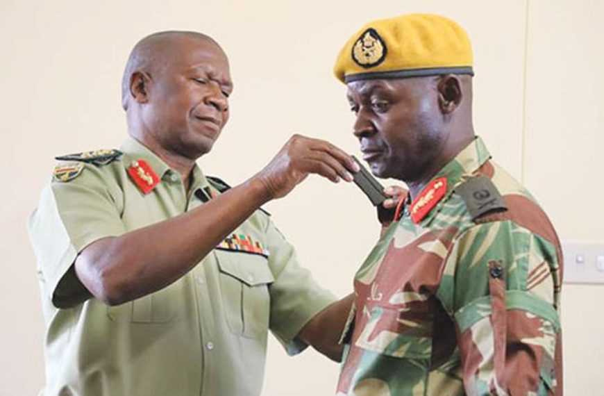 Home 12 Presidential Guard commander Brigadier General Anselem Sanyatwe in 2018 with Zimbabwe Army General Valerio Sibanda (in brown shirt).