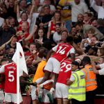 Arsenal players celebrate a goal in their English Premier League match against Manchester City on 8 October 2023.