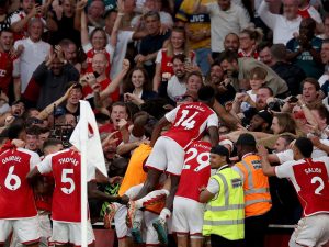 Arsenal players celebrate a goal in their English Premier League match against Manchester City on 8 October 2023.
