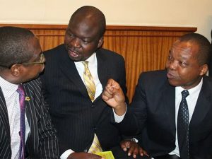Finance and Economic Development Ministry Permanent Secretary George Guvamatanga (centre) chatting with Finance and Economic Development Minister Mthuli Ncube (left) and Reserve Bank of Zimbabwe (RBZ) Governor John Mangudya (right).