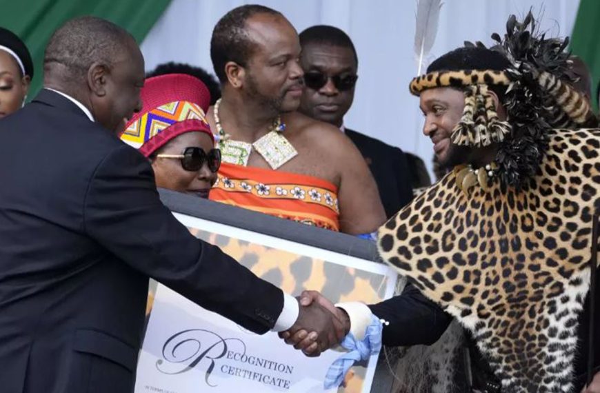 South Africa President Cyril Ramaphosa shakes hand with AmaZulu King Misuzulu kaZwelithini as he hands over a certificate of recognition at the Moses Mabhida Stadium in Durban, South Africa, on Oct. 29, 2022.