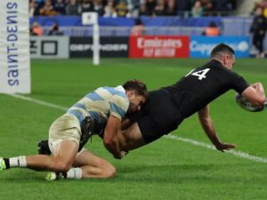 Home 8 New Zealand's right-wing Will Jordan dives across the line to score a try at Stade de France in Saint-Denis, on the outskirts of Paris, on October 20, 2023. © Thomas Samson, AFP