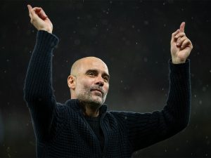 Home 5 Manchester City manager Pep Guardiola celebrates with fans after a 3-0 win against Manchester United in their English Premier league match at Old Trafford on 29 October 2023.