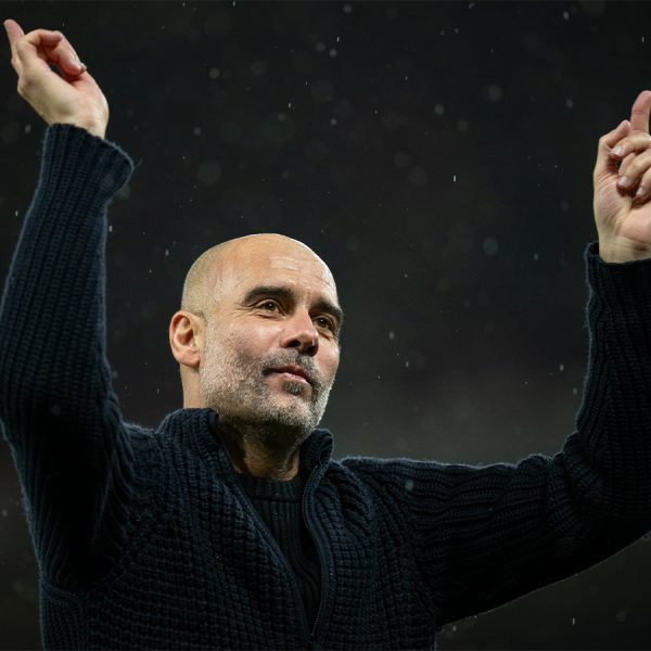 Manchester City manager Pep Guardiola celebrates with fans after a 3-0 win against Manchester United in their English Premier league match at Old Trafford on 29 October 2023.