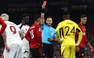 Referee Ivan Kruzliak shows a red card to Manchester United's midfielder #18 Casemiro during the UEFA Champions league group A football match between Manchester United and Galatasaray at Old Trafford stadium in Manchester, north west England, on 3 October 2023. Picture: Darren Staples / AFP