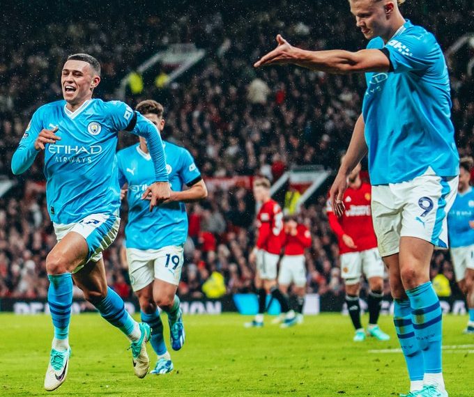 Manchester City's Phil Foden and Erling Haaland celebrate a goal against Manchester United in their English Premier league match at Old Trafford on 29 October 2023.