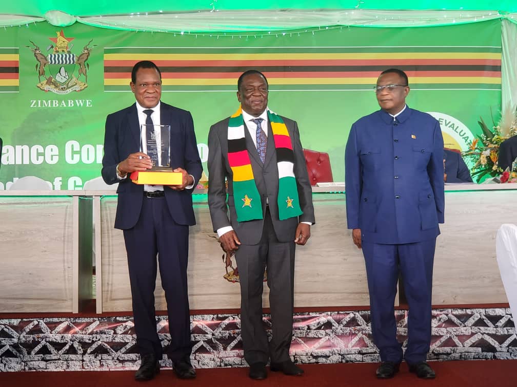 Agriculture Minister Anxious Masuka flanked by President Emmerson Mnangagwa and Vice President Constantino Chiwenga after being accorded the Overall Best Performing Minister Award in March 2023.