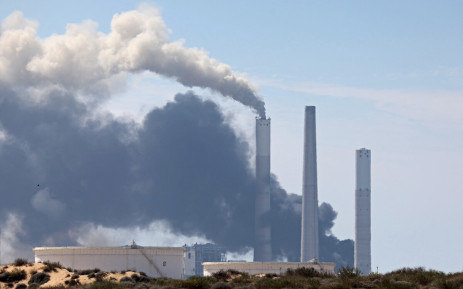 Smoke billows from a power station in Ashkelon on 7 October 2023, as barrages of rockets were fired from the Palestinian enclave into Israeli territory.