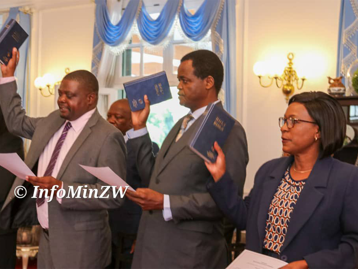 Three new members of the Zimbabwe Gender Commission, namely: Walter Tonderai Mufuka; Angelina Vere and Jigu Katsande are seen in this photo holding Bibles during the swearing in ceremony on 6th November 2023.