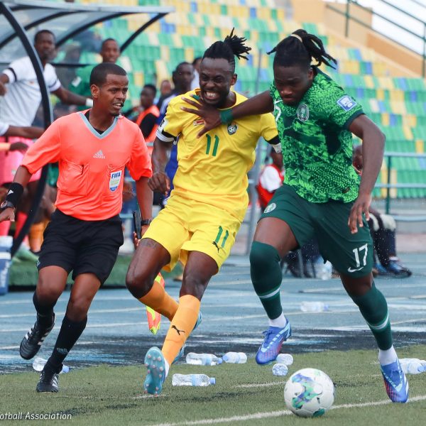 Zimbabwe national team player Tino Kadewere tussles for the ball with Super Eagles star during the 2026 FIFA World Cup match between Zimbabwe and Nigeria at Huye Stadium in Butare, Rwanda on Sunday 19th November 2023.