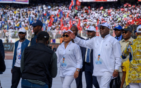 Incumbent President of the Democratic Republic of the Congo and presidential candidate Felix Tshisekedi of the Union for Democracy and Social Progress (UDPS) political party (3rd R) waves to his supporters at the Stade des Martyrs during his first campaign rally as the electoral campaign officially kicks off ahead of the 2023 general elections in Kinshasa on 19 November 2023.