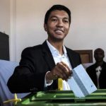 Madagascar President Andry Rajoelina (C) casts his ballot at a polling station in Ambatobe, Antananarivo, during the first round of the country's previous presidential election.