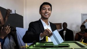 Madagascar President Andry Rajoelina (C) casts his ballot at a polling station in Ambatobe, Antananarivo, during the first round of the country's previous presidential election.