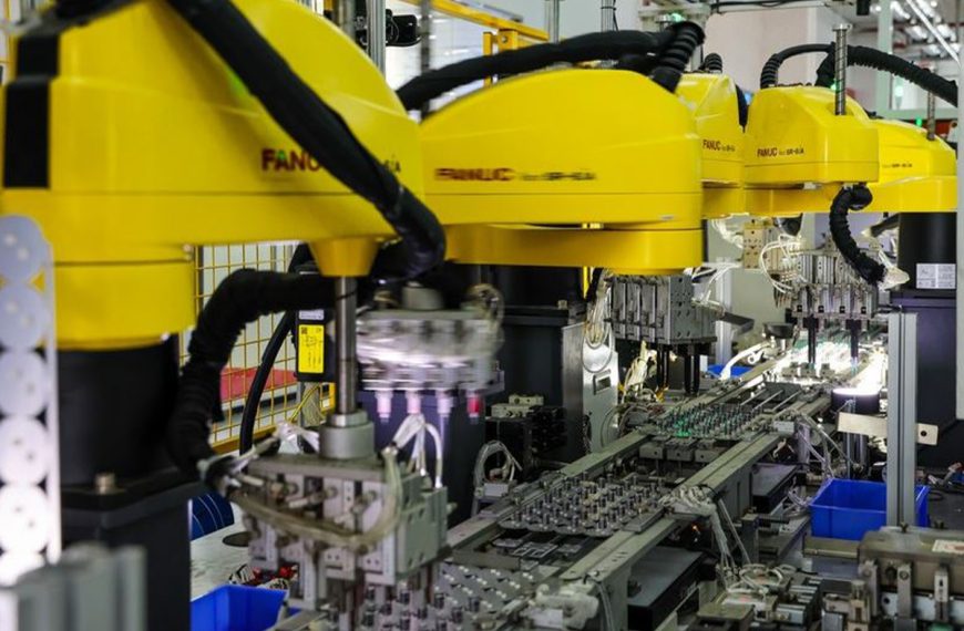 This photo taken on Aug. 9, 2023 shows industry robots working at a production base of Foshan Electrical and Lighting Co., Ltd. in Foshan, south China's Guangdong Province. (Xinhua/Liu Dawei)