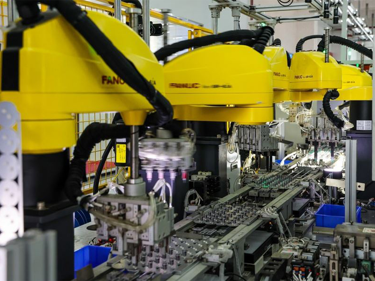 This photo taken on Aug. 9, 2023 shows industry robots working at a production base of Foshan Electrical and Lighting Co., Ltd. in Foshan, south China's Guangdong Province. (Xinhua/Liu Dawei)