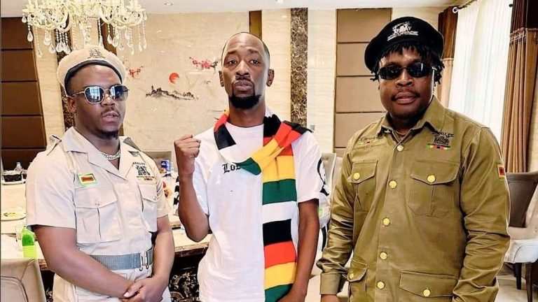 Zimbabwe music stars Poptain Yardbwoy, Holy Ten, Michael Magz pose for a photo clad in Zanu PF regalia