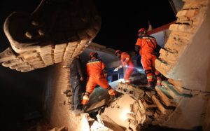 Home 5 Rescue workers search a house for survivors after an earthquake in Kangdiao village, Dahejia, Jishishan County, in northwest China’s Gansu province on 19 December 2023.