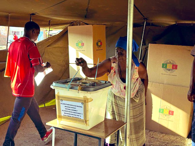 An unidentified elderly woman casts her vote during a by-election in Zimbabwe on Saturday 9th December 2023.