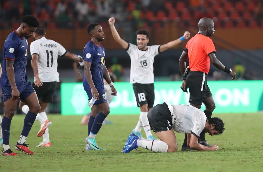 Egypt national team players celebrate after sealing qualification to the last 16 of the Africa Cup of Nations (CAN) 2024 on the last day of group B football match between Cape Verde and Egypt at the Felix Houphouet-Boigny Stadium in Abidjan on 22 January 2024.