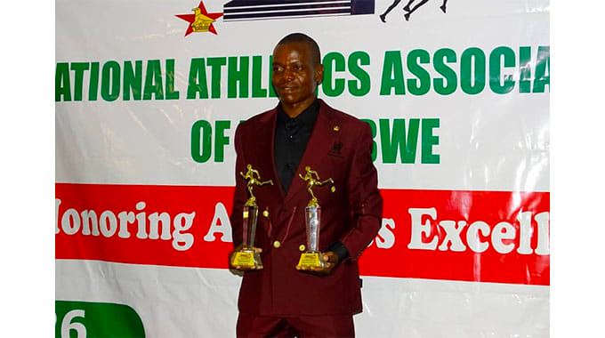 Long distance runner Isaac Mpofu poses for the camera with his awards after being named the 2023 Athlete of the Year at an awards ceremony hosted by the National Athletics Association of Zimbabwe (NAAZ) in Harare on Friday 26th January 2024.