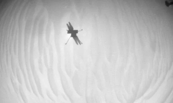 Home 127 Mars Helicopter Sol 1009 - Navigation Camera: NASA's Ingenuity Mars Helicopter acquired this image using its navigation camera. This camera is mounted in the helicopter's fuselage and pointed directly downward to track the ground during flight. This image was acquired on 22 December 2023 (Sol 1009 of the Perseverance rover mission). This was the date of Ingenuity's 70th flight. (Picture: NASA/JPL-Caltech.)