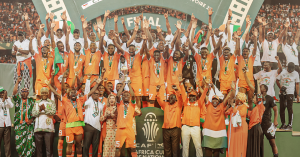 Home 7 Ivory Coast's forward #15 Max-Alain Gradel (C) lifts the Africa Cup of Nations trophy on the podium after Ivory Coast won the Africa Cup of Nations (CAN) 2024 final football match between Ivory Coast and Nigeria at Alassane Ouattara Olympic Stadium in Ebimpe, Abidjan on 11 February 2024.