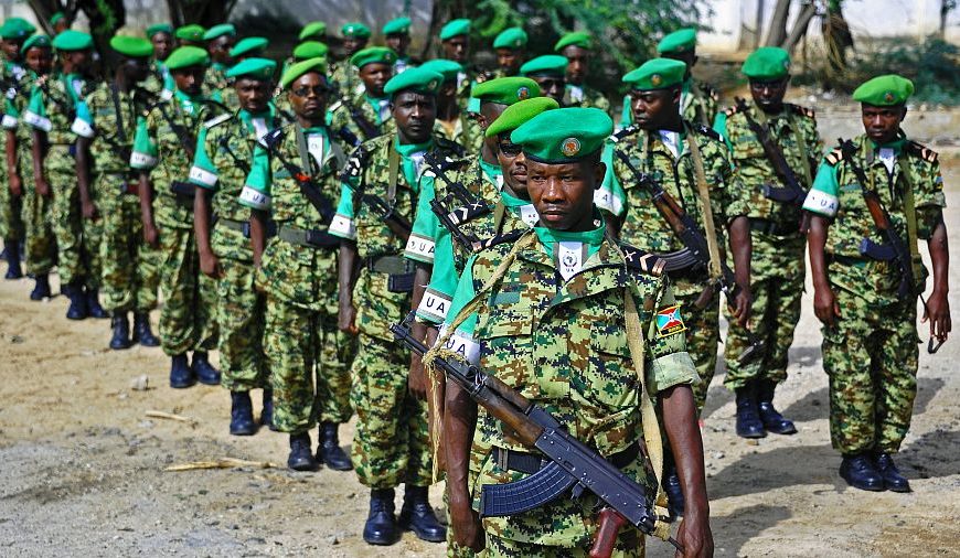 African Union (AMISOM) soldiers from Burundi stand to attention in Mogadishu on July 11, 2017.