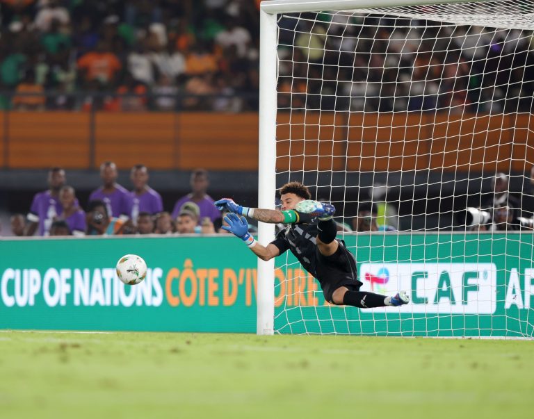 Ronwen Williams (1) of South Africa saves a penalty during the 2023 Africa Cup of Nations Finals match between South Africa and DR Congo in Ivory Coast on 10 February 2024 ©Samuel Shivambu/ BackpagePix