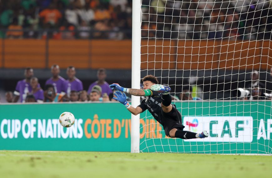Ronwen Williams (1) of South Africa saves a penalty during the 2023 Africa Cup of Nations Finals match between South Africa and DR Congo in Ivory Coast on 10 February 2024 ©Samuel Shivambu/ BackpagePix