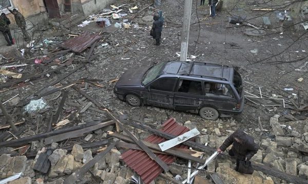 Home 11 Local residents stand among debris in the courtyard of a residential building damaged by a missile attack in the town of Selydove, Donetsk region, on February 8, 2024, amid the Russian invasion of Ukraine. (Photo by Genya SAVILOV / AFP)