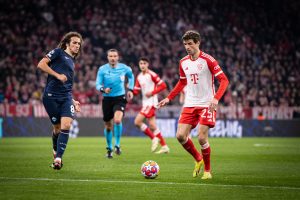 Home 8 Bayern Munich forward Thomas Mueller moves past Lazio player Matteo Guendouzi in a Champions League match player on Tuesday 5th March 2024 in Munich, Germany.