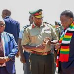Zimbabwe President Emmerson Mnangagwa and Army General Valerio Sibanda share a moment at Robert Mugabe Internation Airport in Harare, Zimbabwe in February 2025.