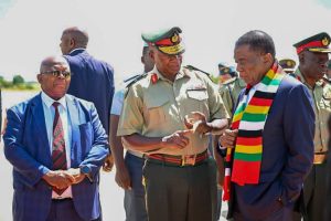 Home 7 Zimbabwe President Emmerson Mnangagwa and Army General Valerio Sibanda share a moment at Robert Mugabe Internation Airport in Harare, Zimbabwe in February 2025.