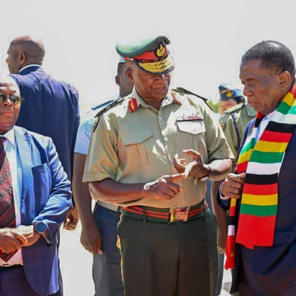 Home 2 Zimbabwe President Emmerson Mnangagwa and Army General Valerio Sibanda share a moment at Robert Mugabe Internation Airport in Harare, Zimbabwe in February 2025.